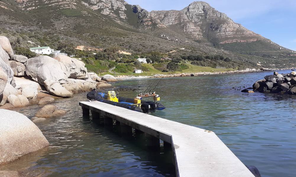 Group of friends on a social boat trip near Table Mountain